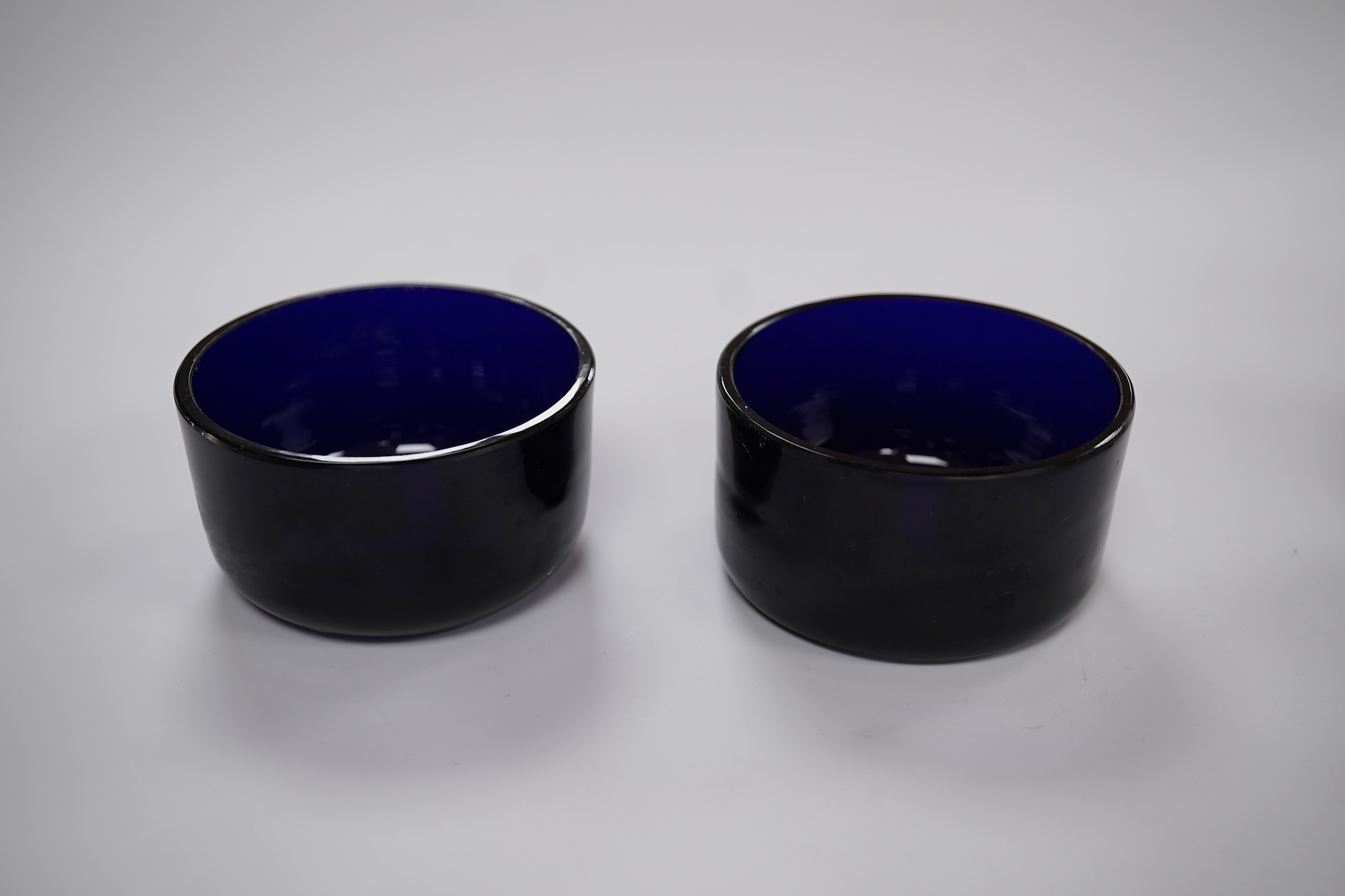 A pair of early Victorian silver cauldron salts, by John Tapley, London, 1838, with later blue glass liners, diameter 94mm, together with a pair of George IV silver Old English pattern condiment spoons, London, 1828.